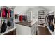 Spacious walk-in closet with custom shelving and center island for ample storage at 2903 Eva Clb, Acworth, GA 30101