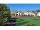 Expansive green lawn with surrounding mulch beds offers a serene outdoor space at 2903 Eva Clb, Acworth, GA 30101