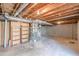 Spacious unfinished basement with an open ceiling offers potential for customization at 3344 Creekwood Dr, Rex, GA 30273