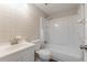 Bathroom with white tile, vanity, toilet, and shower with tub for a clean and functional space at 3344 Creekwood Dr, Rex, GA 30273