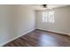 Neutral bedroom featuring a window and wood-look floors for a serene atmosphere at 3344 Creekwood Dr, Rex, GA 30273