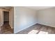 Bedroom featuring neutral walls, wood-look floors, and a doorway leading to another room at 3344 Creekwood Dr, Rex, GA 30273