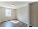 Bedroom featuring neutral walls, plush carpet, a window with natural light, and a ceiling light at 3344 Creekwood Dr, Rex, GA 30273