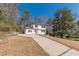 Comfortable home with a spacious driveway and mature trees, situated on a well-maintained lot at 3344 Creekwood Dr, Rex, GA 30273