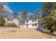 Charming home with a tidy front lawn and traditional black and white design elements at 3344 Creekwood Dr, Rex, GA 30273