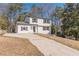 Inviting home featuring a freshly painted exterior, neat landscaping, and a lengthy private driveway at 3344 Creekwood Dr, Rex, GA 30273