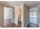 Hallway with half bathroom, view into the living room and backyard access at 3344 Creekwood Dr, Rex, GA 30273