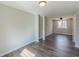 Bright living room featuring neutral walls, wood-look floors, and a ceiling fan near the window at 3344 Creekwood Dr, Rex, GA 30273