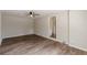 Living room featuring stylish wood-look floors and neutral paint at 3344 Creekwood Dr, Rex, GA 30273