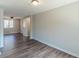 Open living room with modern flooring and fresh paint is ready for your personal touch at 3344 Creekwood Dr, Rex, GA 30273