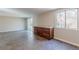 Living room features wood look tile, large window, and cabinetry with granite countertops at 3344 Creekwood Dr, Rex, GA 30273