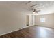 Living room showcases stylish wood-look floors, fan, and neutral decor at 3344 Creekwood Dr, Rex, GA 30273