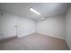 Finished basement area with neutral carpet and white walls at 3777 Clubhouse Way, Conyers, GA 30094