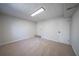 Finished basement area with neutral carpet, white walls, and recessed lighting at 3777 Clubhouse Way, Conyers, GA 30094