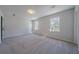 Spacious carpeted bedroom with natural light from two windows at 3777 Clubhouse Way, Conyers, GA 30094