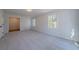 Spacious bedroom with plush carpeting and natural light at 3777 Clubhouse Way, Conyers, GA 30094