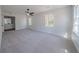 Spacious bedroom with carpet flooring, great natural light, and a ceiling fan at 3777 Clubhouse Way, Conyers, GA 30094