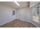 Bonus room features wood-look flooring, an exterior glass pane door and a window at 3777 Clubhouse Way, Conyers, GA 30094