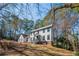 Two-story home with white siding, black shutters, and a landscaped front yard at 3777 Clubhouse Way, Conyers, GA 30094