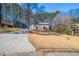 Traditional two-story home with well-manicured lawn and long driveway at 3777 Clubhouse Way, Conyers, GA 30094