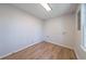 Bright laundry room with wood-look flooring and modern hookups at 3777 Clubhouse Way, Conyers, GA 30094