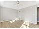 Bright main bedroom with a ceiling fan, two windows, and light-colored walls at 54 Timber Ridge Dr, Cartersville, GA 30121