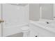 Bathroom featuring a shower-tub, toilet, and single sink vanity with white cabinetry at 627 W Oaks Dr, Woodstock, GA 30188