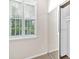 Bedroom featuring white window shutters and a mirrored closet door at 627 W Oaks Dr, Woodstock, GA 30188