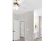 Hallway with neutral paint and doors, providing a sense of privacy and direction at 627 W Oaks Dr, Woodstock, GA 30188