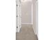 Hallway with neutral paint and trim, showing doors and carpeted floor at 627 W Oaks Dr, Woodstock, GA 30188