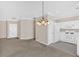 Cozy kitchen with white appliances and ample natural light, located near the front entrance at 627 W Oaks Dr, Woodstock, GA 30188