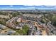 An aerial view of a dense residential neighborhood with mature trees and various townhomes and apartment buildings at 1992 Cobblestone Ne Cir, Brookhaven, GA 30319