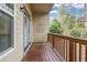 Outdoor balcony with wooden railing and siding at 1992 Cobblestone Ne Cir, Brookhaven, GA 30319