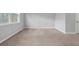 Unfurnished bedroom with neutral carpet and a bright window at 1992 Cobblestone Ne Cir, Brookhaven, GA 30319