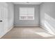 Bedroom featuring neutral walls, plush carpet, and a window with great natural light at 1992 Cobblestone Ne Cir, Brookhaven, GA 30319