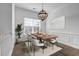 Elegant dining room featuring hardwood floors, modern chandelier, and large window at 1992 Cobblestone Ne Cir, Brookhaven, GA 30319