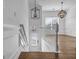 Bright entryway with hardwood floors, white trim, stairs, and modern lighting fixtures at 1992 Cobblestone Ne Cir, Brookhaven, GA 30319