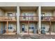 Exterior featuring wooden decks, a beige facade, and multiple entrances at 1992 Cobblestone Ne Cir, Brookhaven, GA 30319