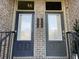 Paired townhouse front doors with visible house numbers and wrought iron railings at 1992 Cobblestone Ne Cir, Brookhaven, GA 30319