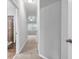 Hallway leading to bedroom and bathroom with neutral carpet at 1992 Cobblestone Ne Cir, Brookhaven, GA 30319