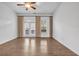 Unfurnished living room with hardwood floors and balcony access at 1992 Cobblestone Ne Cir, Brookhaven, GA 30319