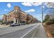 Street view of the building's exterior, sidewalks, and storefronts with street parking at 1992 Cobblestone Ne Cir, Brookhaven, GA 30319