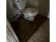 Image of an outdated bathroom with damaged flooring and standard toilet at 2802 Ocean Valley Dr, Atlanta, GA 30349