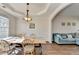 An inviting dining room with wood floors, stylish lighting, and a comfortable seating arrangement at 3202 Monarch Pine Dr, Peachtree Corners, GA 30071