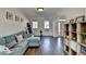 Comfortable living room featuring hardwood floors, natural light, and stylish decor at 3202 Monarch Pine Dr, Peachtree Corners, GA 30071