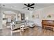 Bright living room with hardwood floors, comfortable seating, and kitchen access at 3202 Monarch Pine Dr, Peachtree Corners, GA 30071