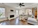 Spacious living room featuring a fireplace and views into the kitchen area at 3202 Monarch Pine Dr, Peachtree Corners, GA 30071