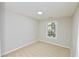 Sunny, neutral bedroom with carpet floors, white walls and natural lighting at 506 Summer Pl, Norcross, GA 30071