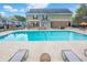 Large community pool with lounge chairs and patio furniture at 506 Summer Pl, Norcross, GA 30071