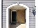 Close-up of the entryway featuring brick accents, black door, and overhead light at 506 Summer Pl, Norcross, GA 30071